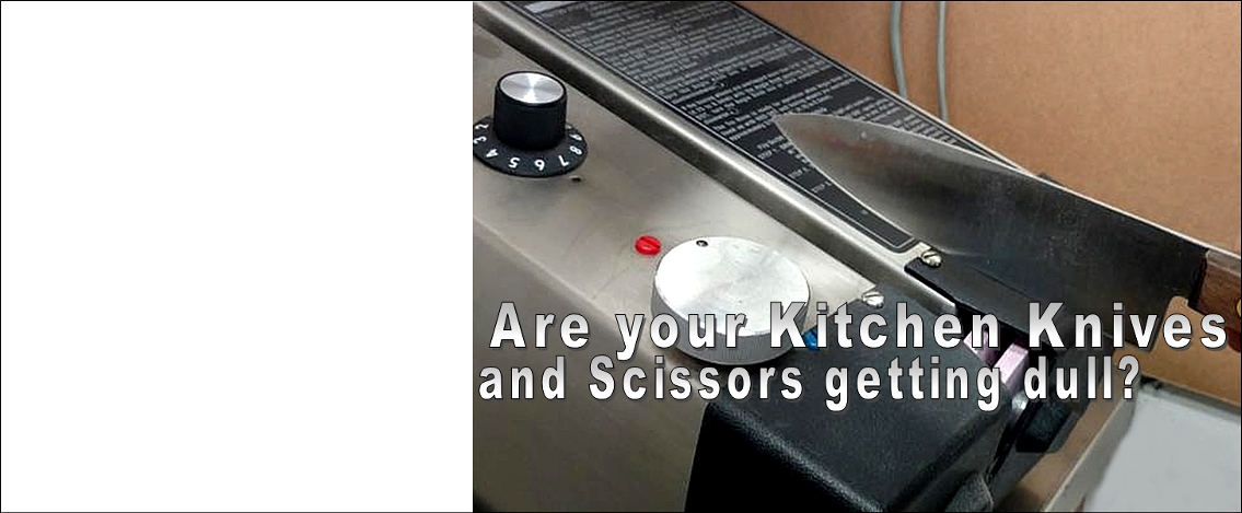 knife in foreground and bbq grill dials in the background